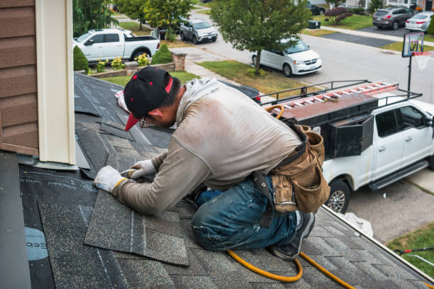Professional Gutter Repair And Installation technician working in Oakland Gardens, NY